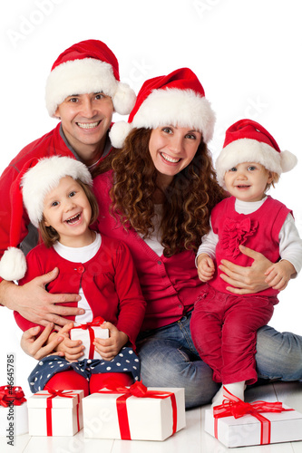 Photo: Happy family celebrating Christmas Happy family celebrating Christmas