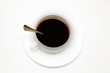 cup of black coffee with a spoon, top view