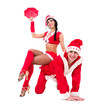 Happy young couple wearing santa claus clothes