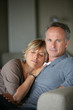 Foto: Couple relaxing on a sofa Couple relaxing on a sofa