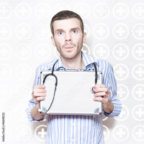 Photo: Medical Doctor With Stethoscope And First Aid Kit Medical Doctor With Stethoscope And First Aid Kit