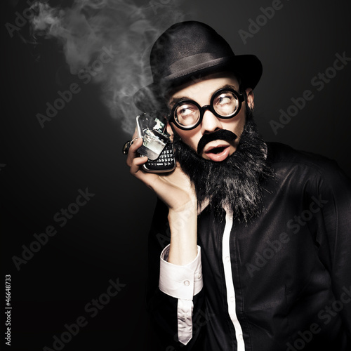 Photo: Business Man Talking On Broken Smart Mobile Phone Business Man Talking On Broken Smart Mobile Phone