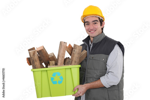 Photo: craftsman holding a box with recycling materials craftsman holding a box with recycling materials