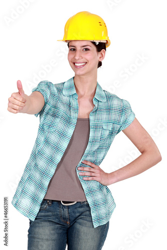 Photo: Female construction worker thumbs-up Female construction worker thumbs-up