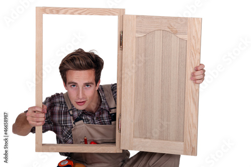 Photo: craftsman looking through a window frame craftsman looking through a window frame