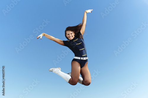 Photo: Young female dancer against white background Young female dancer against white background