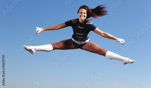 Photo: Young female dancer against white background Young female dancer against white background