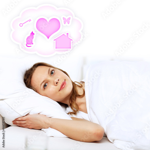 Photo: Young woman in white with heart symbols Young woman in white with heart symbols