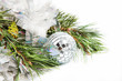 Fir tree branch with Christmas ball and shiny tinsel