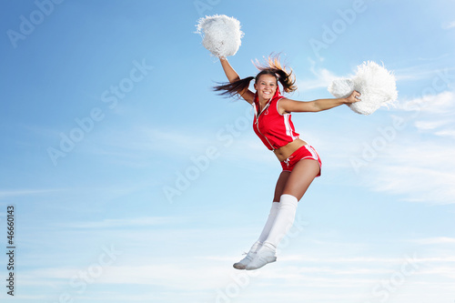 Photo: Young female cheerleader Young female cheerleader