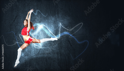 Photo: Young woman dancer. With lights effect. Young woman dancer. With lights effect.