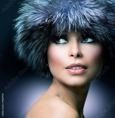 Photo: Winter Fashion. Fur Hat. Beautiful Girl in Furry Hat Winter Fashion. Fur Hat. Beautiful Girl in Furry Hat