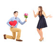 Photo: Male on knee giving a bouquet of flowers to his girlfriend Male on knee giving a bouquet of flowers to his girlfriend