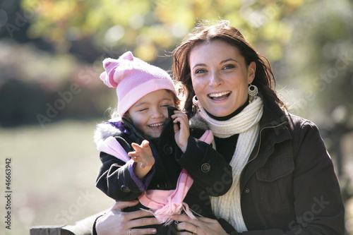 Photo: mother holding her baby girl mother holding her baby girl