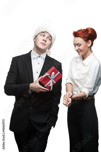 Photo: business people giving red christmas gift business people giving red christmas gift