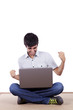 Photo: Happy young man surfing the internet Happy young man surfing the internet