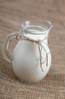 Glass jug with milk