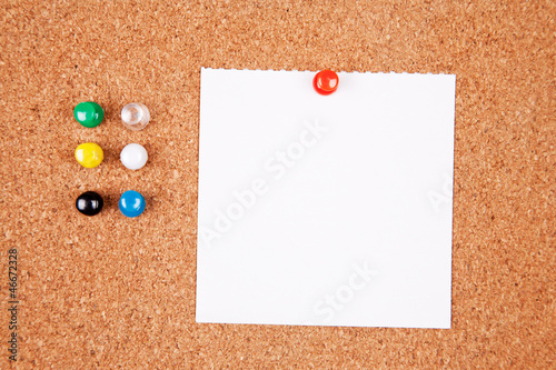 Photo: Cork bulletin board with notes. Cork bulletin board with notes.