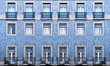 Lisbon windows with typical portuguese tiles on the wall