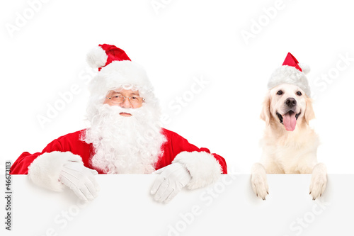 Photo: Santa Claus and dog posing behind a billboard Santa Claus and dog posing behind a billboard