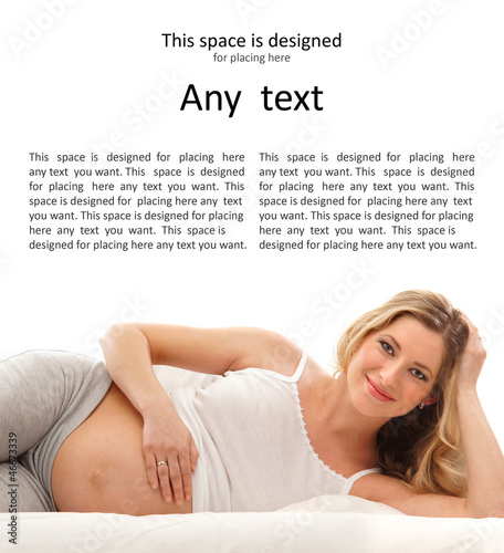 Photo: A young and happy blond pregnant woman in white lingerie A young and happy blond pregnant woman in white lingerie