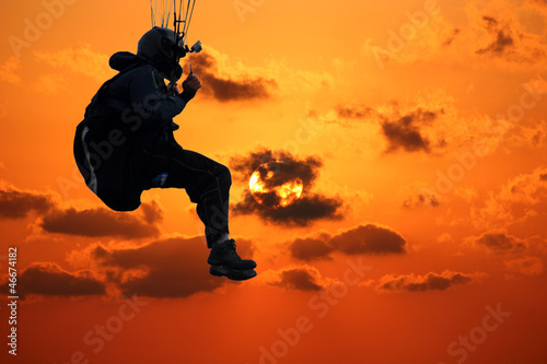 Photo: paraglider at sunset paraglider at sunset