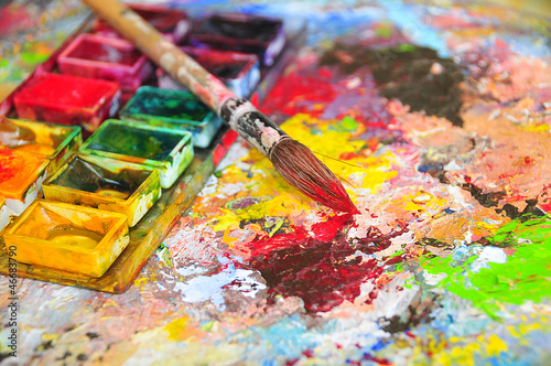 Photo: Brush dipped in red color Brush dipped in red color
