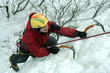 Man climbing frozen waterfall