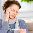 Headache. Sick Woman with Thermometer. Flu
