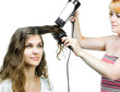 Hairdresser makes hairstyle