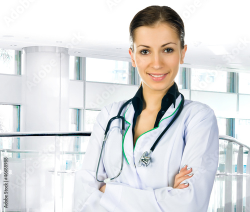 Photo: doctor woman with stethoscope in clinic doctor woman with stethoscope in clinic