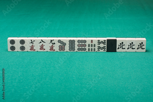 Photo: Smooth table surface with a mahjong on it Smooth table surface with a mahjong on it