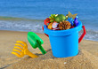Photo: Christmas decorations and children's toys on the beach Christmas decorations and children's toys on the beach