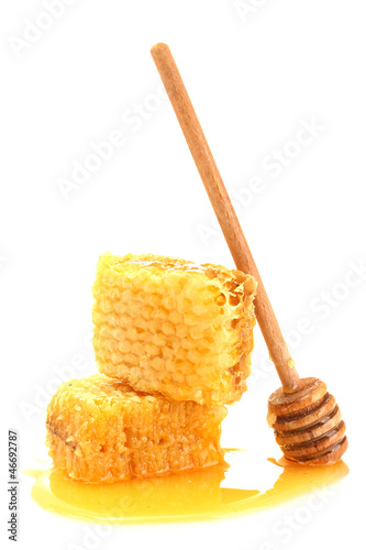 Photo: golden honeycombs with honey isolated on white. golden honeycombs with honey isolated on white.