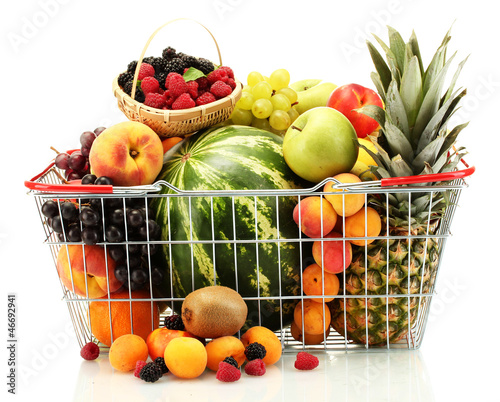 Photo: Assortment of exotic fruits in metal basket isolated on white Assortment of exotic fruits in metal basket isolated on white