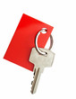 Key with blank red label for your text isolated on white backgro