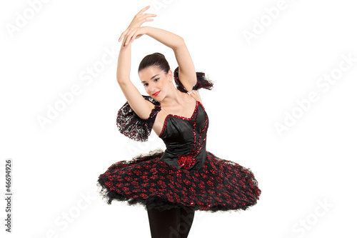 Photo: A ballerina dancer making a ballet posing A ballerina dancer making a ballet posing