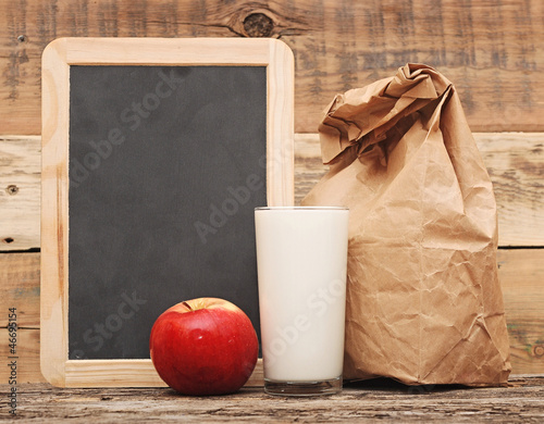Photo: school lunch over blank blackboard school lunch over blank blackboard