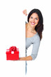 Beautiful young Christmas girl with a present.