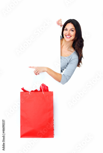 Photo: Beautiful shopping Christmas woman with bag. Beautiful shopping Christmas woman with bag.
