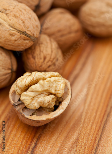 Photo: walnuts on wooden table walnuts on wooden table