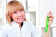 Foto: beautiful woman holds a test tube with green liquid beautiful woman holds a test tube with green liquid