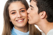 Boyfriend kissing girlfriend on cheek. Boyfriend kissing girlfriend on cheek.