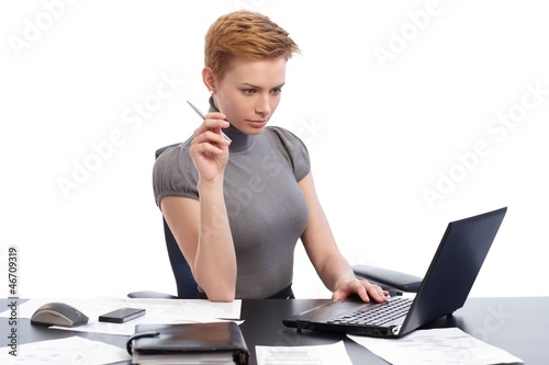Photo: Young woman busy by working Young woman busy by working
