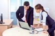 Boss and woman working in office