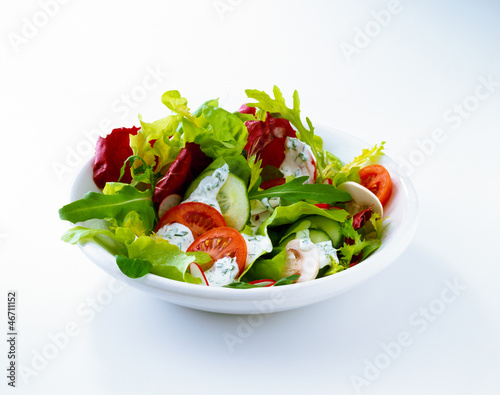 Photo: Salad with tomato, radishes, and dressing Salad with tomato, radishes, and dressing