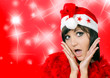 Charming young woman in santa cap