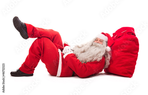 Photo: Santa Claus lie on bag Santa Claus lie on bag