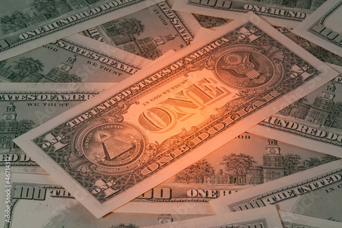 Photo: Background with American dollar bills with mysterious light Background with American dollar bills with mysterious light