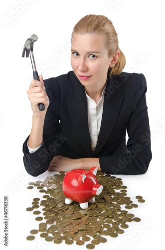 Photo: Woman breaking piggy bank for savings Woman breaking piggy bank for savings